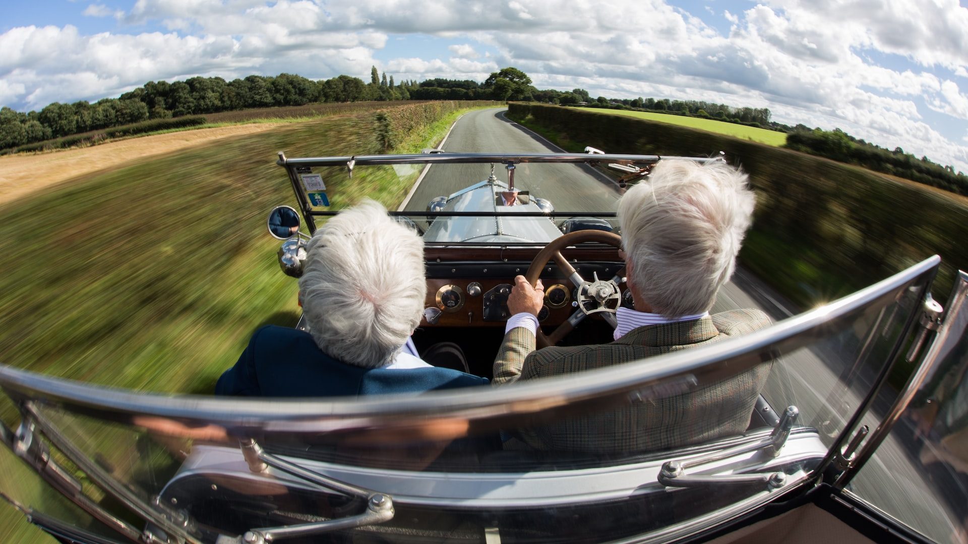 two person ride on car during daytime